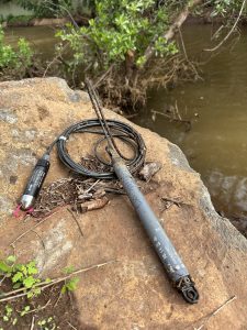 A picture of a water-level logger on a rock in a South Maui muliwai